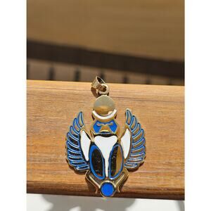 winged scarab carrying the sun pendant